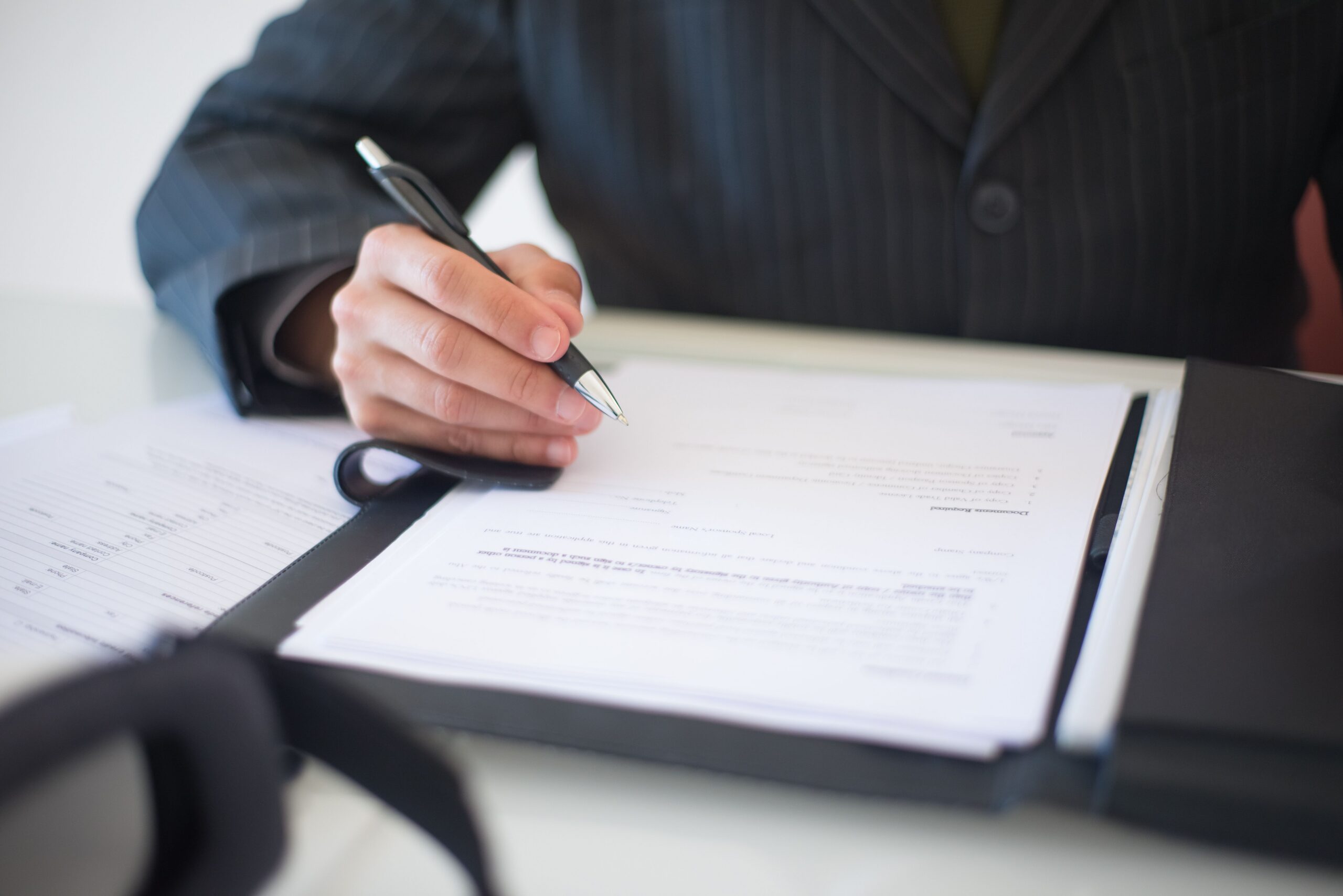 What documents do I need for a truck accident consultation — client reviewing paperwork before signing